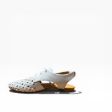 White shoe with wooden sole on a white background
