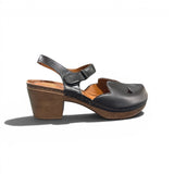 Black sandal with heel and cover toe and ankle strap on a white background