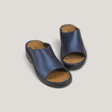 Naot Rome 67820 slip-on sandal with tan leather straps and cushioned footbed, displayed against a neutral background.