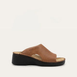 Brown sandal with a black sole on a white background