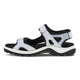 Light blue sandal with black and white accents on a white background
