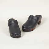 Black leather heel shoe on a white backgroud