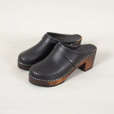 Black leather heel shoe on a white backgroud
