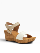 Strada Naot Summer wedge sandal in white and beige leather with an adjustable ankle strap and cork-textured platform.