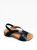 Black sandal with wooden sole on a white background