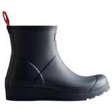 A single blue rubber rain boot with a red pull tab and a small white brand tag on the side, shown from a profile view against a solid white background.