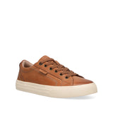 Brown leather sneaker with a white sole on a white background