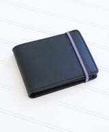 Carré Royal minimalist leather wallet in black with multiple card slots, slim design, and sleek finish.