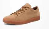 Tan sneaker with brown sole on a white background