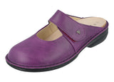 Purple shoe with a strap on a white background