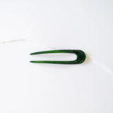 Green Tiepology Eco French hair pin with sleek design, perfect for securing hair in stylish updos and everyday hairstyles.