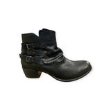 Eric Michael Carlita ankle boot featuring a sleek leather design with a rounded toe and low heel, perfect for stylish fall footwear.