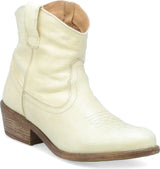Miz Mooz Carlitos women's Western boot with tan leather, pointed toe, and decorative stitching, standing on a wooden surface.