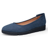 Blue suede flat shoe on a white background