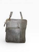 Light grey crossbody bag and a white background