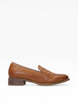 Tan leather loafer shoe on a white background