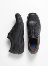 Pair of black leather sneaker on a white background