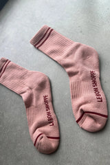 Pink Le Bon Shoppe Boyfriend Socks displayed on a textured surface, showcasing their soft fabric and relaxed fit.