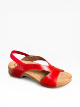 Red sandal with a wooden sole on a white background