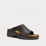A single black leather slide sandal with a chunky platform sole and a contrasting tan insole, shown from a side profile on a light gray background.