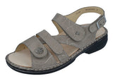Finn Comfort Gomera women's sandal with leather straps and cushioned footbed, shown on a neutral background.