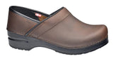 Brown clog shoe with black sole on a white background