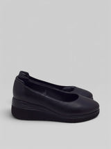 Strada Ara Berkeley black leather wedge pumps with a round toe and comfortable cushioned heel for work or casual wear.