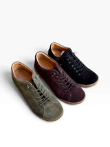 Strada Gelato Tessa II suede sneakers in olive, dark brown, and black with rubber soles and detailed heel stitching.