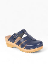 Strada navy blue leather Mary Jane open-back clog with adjustable strap and wood sole. Features cut-out details and silver stud trim.