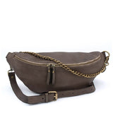 Strada taupe leather sling bag with antique bronze chain and adjustable strap, featuring double zip closure.