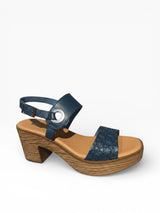 Strada Women's Wanda casual heeled sandal in lavender leather with adjustable ankle strap and floral patterned vamp.