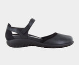 Black mary jane shoe and a white background