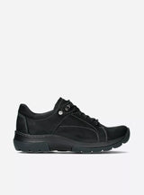 black sneaker against a white background