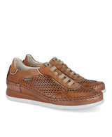Brown leather sneakers with white soles on a white background